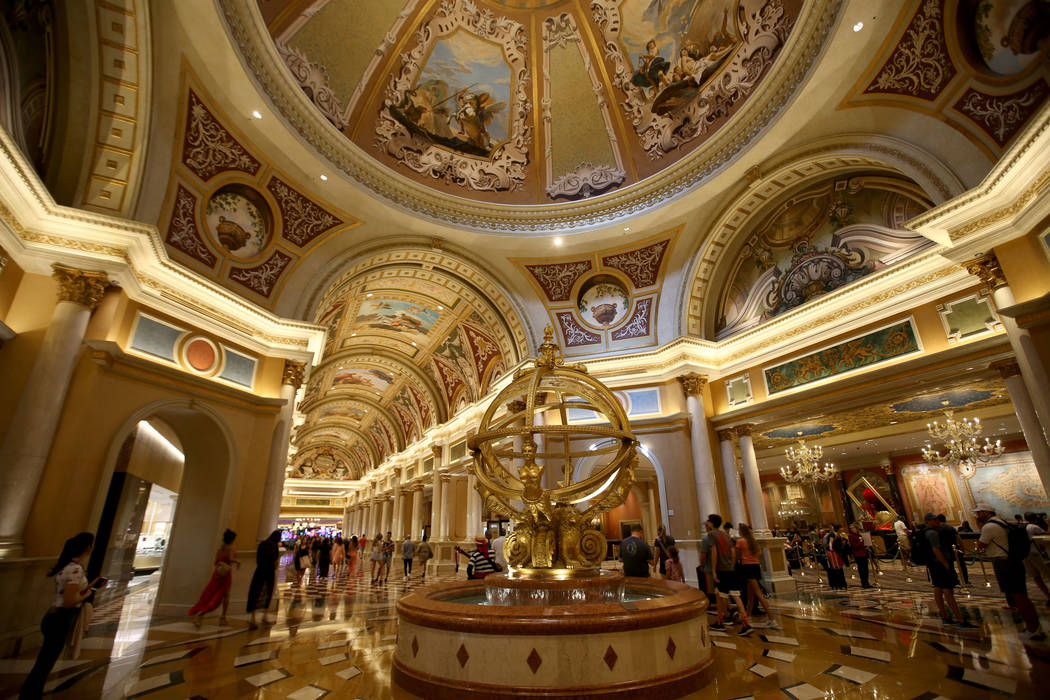 Guests mingle at the Armillary Sphere near the front desk at The Venetian on the Strip in Las V ...