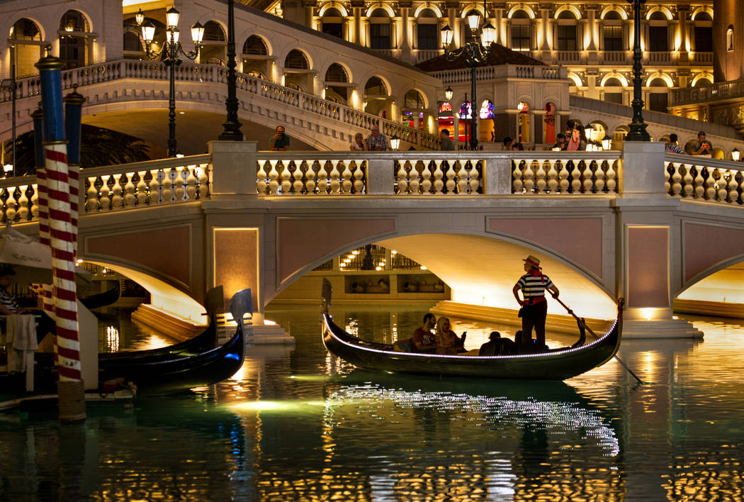 Tourists ride gondolas at The Venetian on Wednesday, April 24, 2019, in Las Vegas. (L.E. Baskow ...