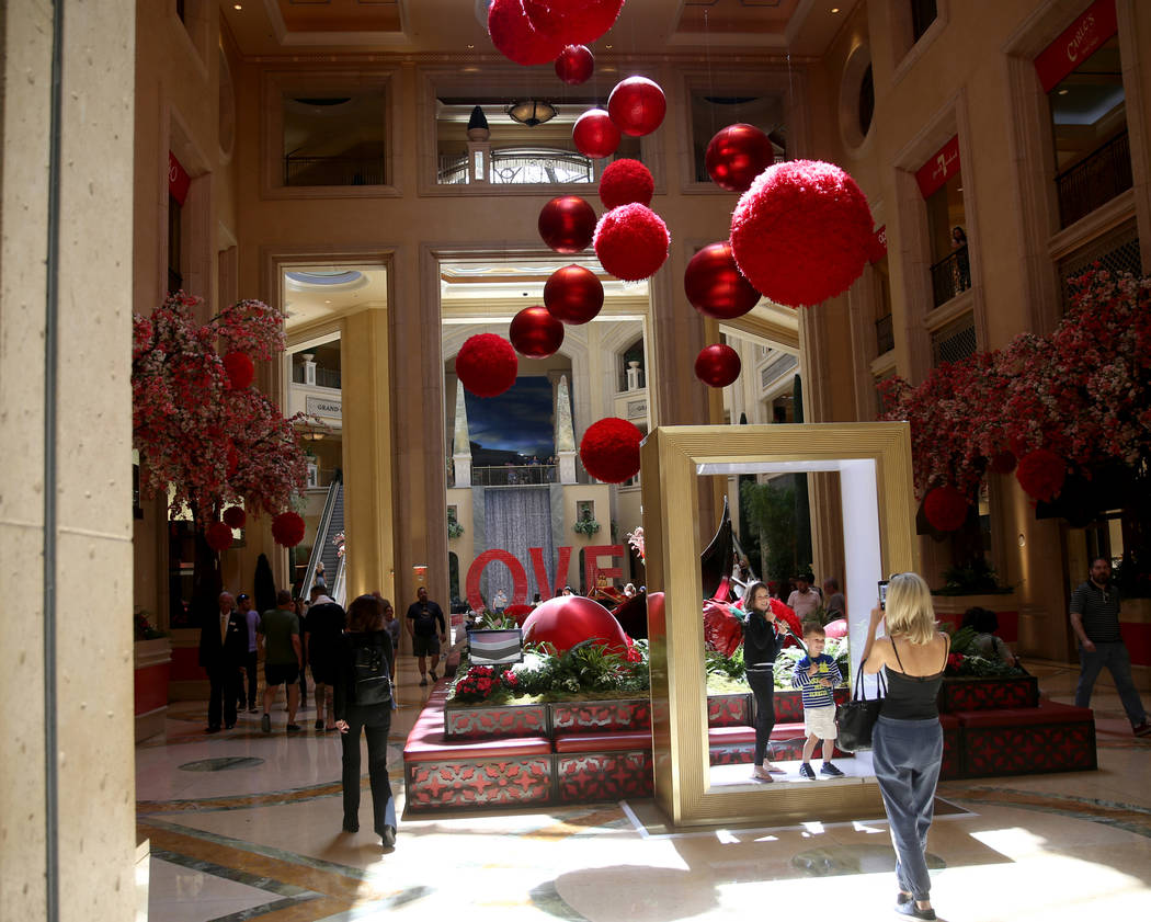 Guests mingle in the Waterfall Atrium at The Venetian on the Strip in Las Vegas Thursday, April ...